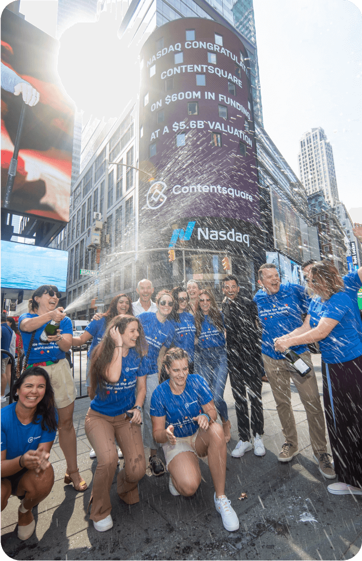 Our team poping champagne to celebrate our Series F funding on Times square